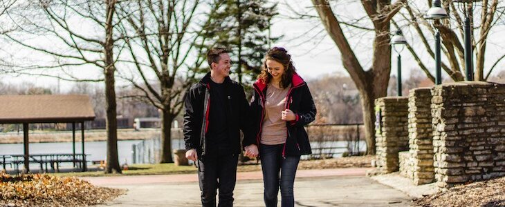 young couple walking hand in hand