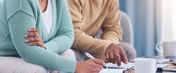 senior couple works on estate planning documents